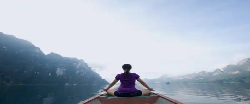 Female on a lake boat ride. Build your confidence by accepting yourself. Learn how @ i-am-meditations.com