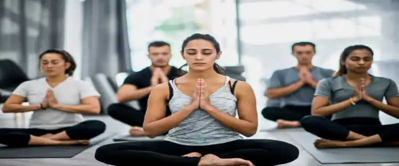 Meditation and its methods demonstrated by a group of people meditating in a room. Yoga practice @ i-am-meditations.com