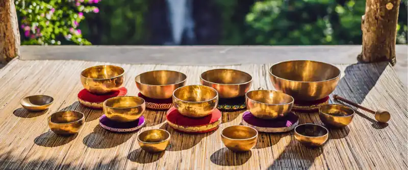 A group of singing bowls. Listening to meditation music embedded with singing bowls can clean our energy field, also called an aura. Learn more @ i-am-meditations.com