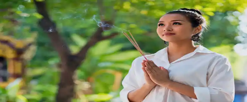 Asian female visualizing with open eyes. Visualization meditation is on of the many methods of meditation. Learn more @ i-am-meditations.com